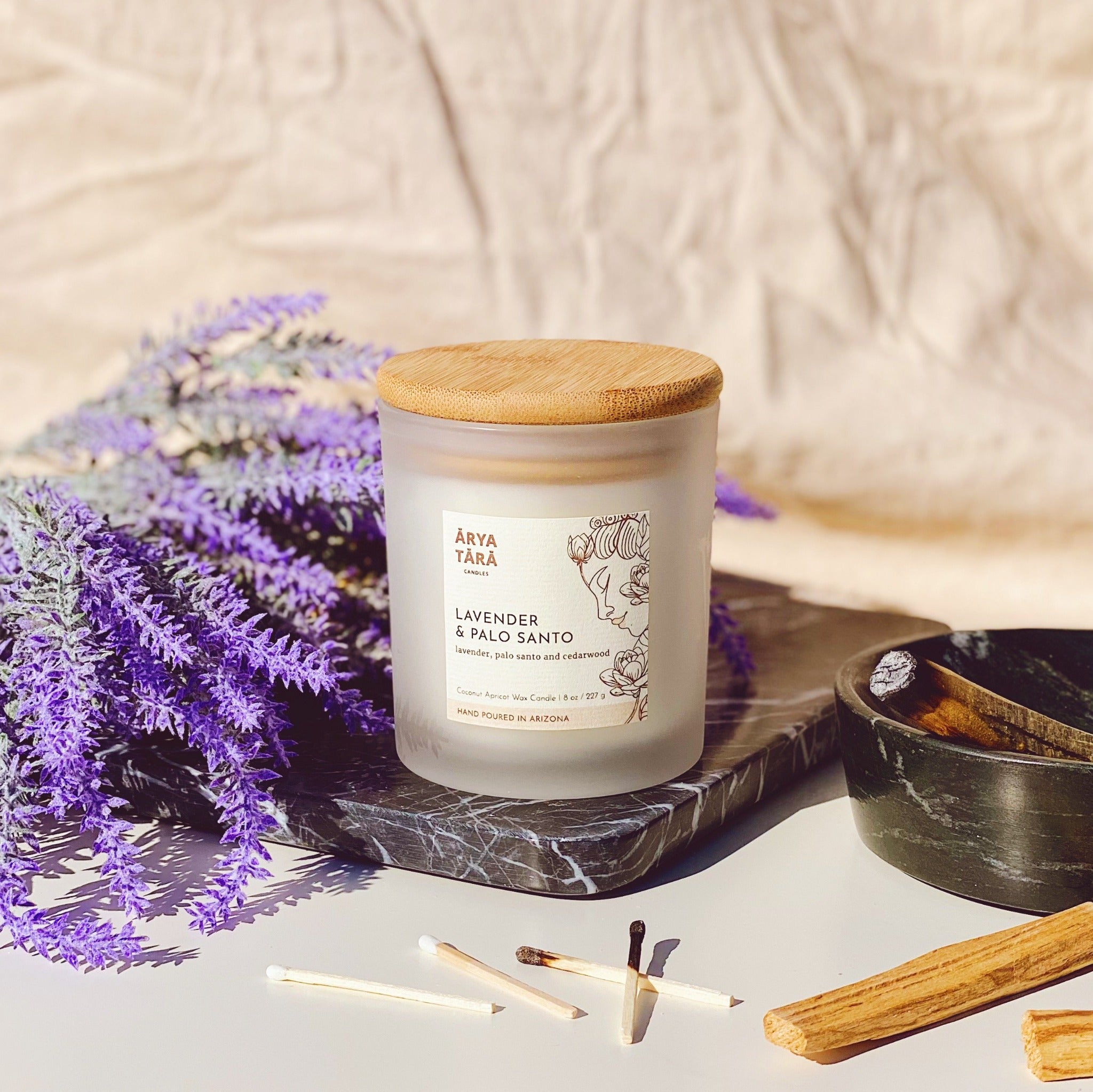 Lavender and Palo Santo Candle by Arya Tara Candles. Provence lavender, palo santo and Atlas cedarwood. French lavender and South American palo santo scented candle. Non-toxic natural candle made with coconut apricot wax, lead-free zinc-free wicks, premium fragrances. Luxury candle, natural candle. Made in Tucson Arizona, hand poured candle in small batch.