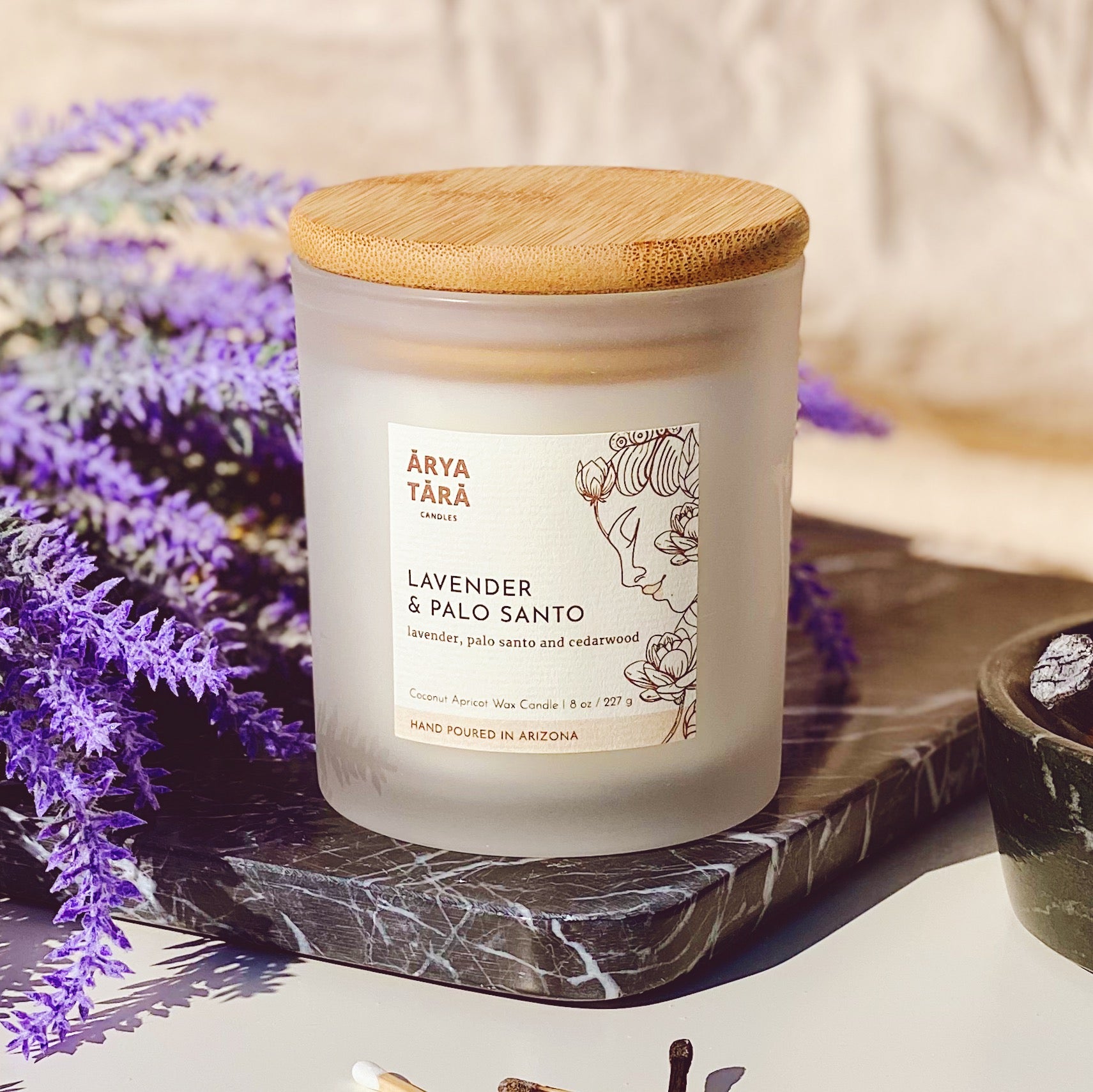 Lavender and Palo Santo Candle by Arya Tara Candles. Provence lavender, palo santo and Atlas cedarwood. French lavender and South American palo santo scented candle. Non-toxic natural candle made with coconut apricot wax, lead-free zinc-free wicks, premium fragrances. Luxury candle, natural candle. Made in Tucson Arizona, hand poured candle in small batch.